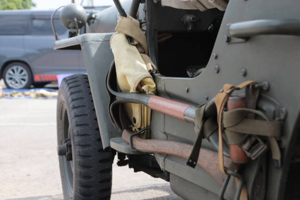 United States Army Second World War era jeep pioneer tools This side view of a WW2 period Willys Jeep shows the rugged off roading tyres that jeeps were issued with, and the tools that were attached to the side; an axe and a shovel for if the jeep should become stuck or bogged down.
This image was taken at an outdoor event over the weekend of 25th June June 2023, where reenactors, living historians, and members of the public can come to experience what life was like during the second world war, with live demonstrations, battle reenactments, and static displays from all over the world. jeep 4x4 off road vehicle world war ii stock pictures, royalty-free photos & images
