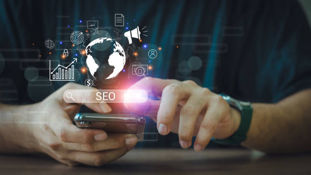 istock Businessman use smartphone to analyze SEO search engine optimization for promoting ranking traffic on website and optimizing your website to rank in search engines. 2155130764