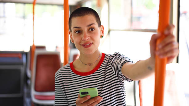 istock Girl surfing the net while riding in a bus 2155130888