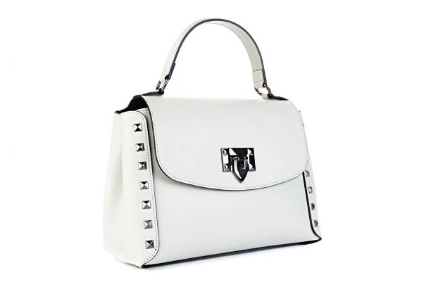 istock White female handbag bag purse clutch on whete background. Isolated on white background.Front view. 2155133338
