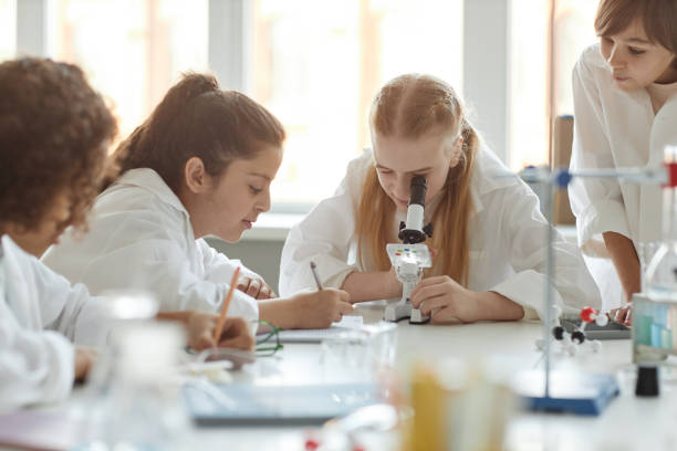 istock Ethnically Diverse Kids Having Chemistry Lesson 2155134170