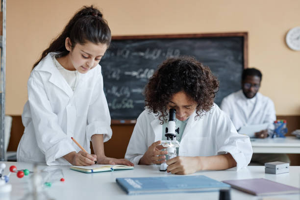 istock Boy And Girl During Chemistry Class 2155134208