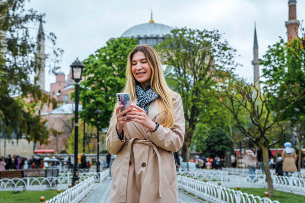 istock Young woman using phone in Istanbul 2155135362