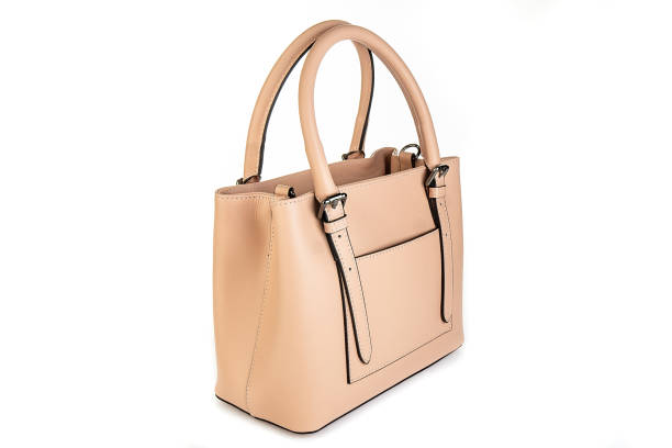 istock beige leather bag isolated on white background. minimalist purse ,handbag 2155135577