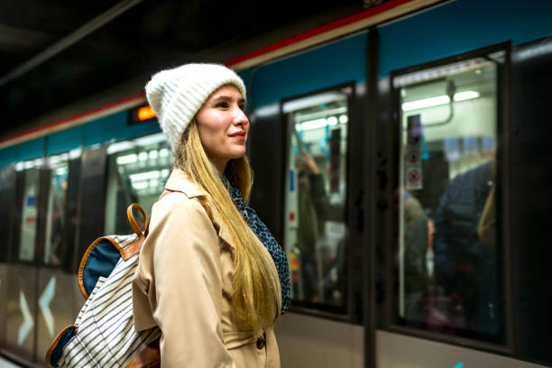 istock Young woman waiting for the subway 2155136258