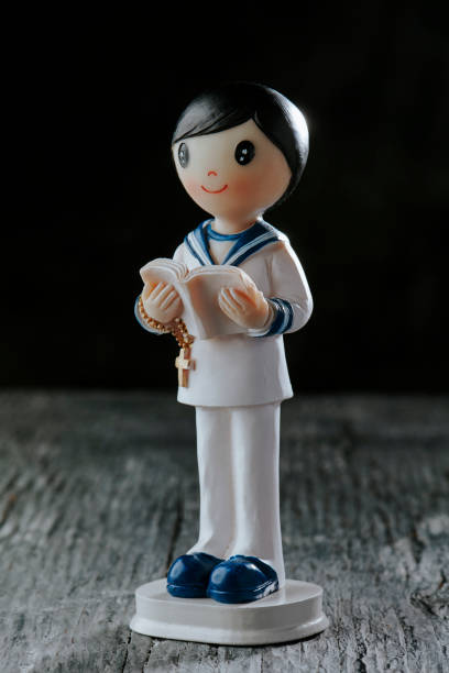 istock figurine of a first communion boy in sailor suit 2155136553