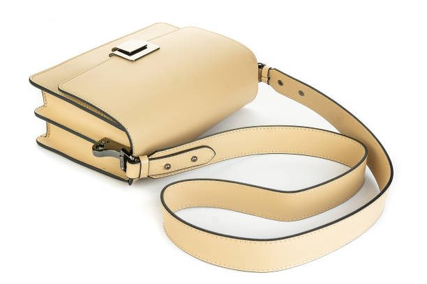 istock beige leather bag isolated on white background. minimalist purse ,handbag 2155137115