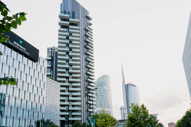 contrapicado view of large office buildings, next to a residential apartment skyscraper, in the Garibaldi district of Milan-Italy. Milan financial district at sunset