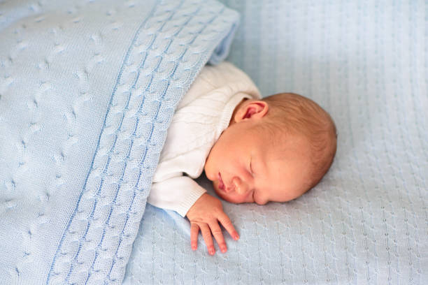 istock Newborn baby boy on a blue blanket 2155138537