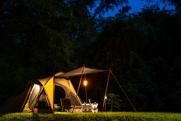 istock Set up a tent in the dusk at campground 2155146150