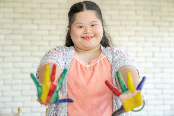 istock The young girl is show both hands painted with colors 2155146167