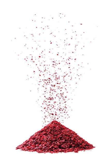 istock Sumac spice spills onto a heap on a white background. Isolated 2155146483