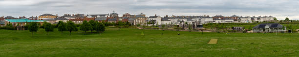 Panorama of Poundbury, urban extension to the Dorset county town of Dorchester, England View of Poundbury, new neighbourhood on the edge of Dorchester new urbanism stock pictures, royalty-free photos & images