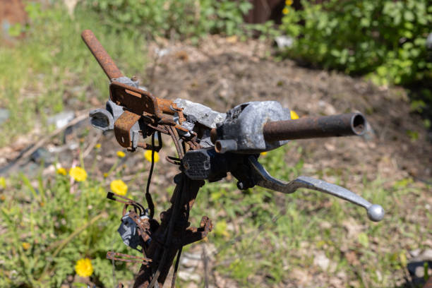 Burned rusty handlebar of motorbike closeup. .