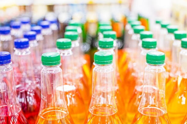 drinks in plastic containers on the counter in a supermarket