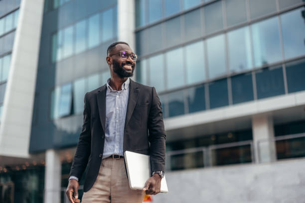 istock Afro American businessman with laptop 2155149104