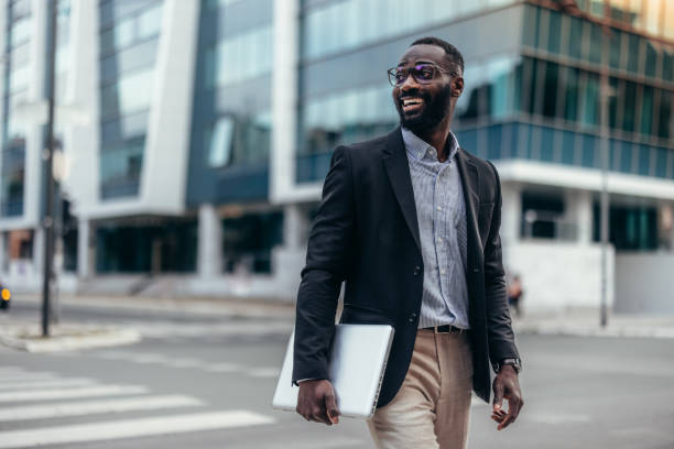 istock Afro American businessman with laptop 2155149143