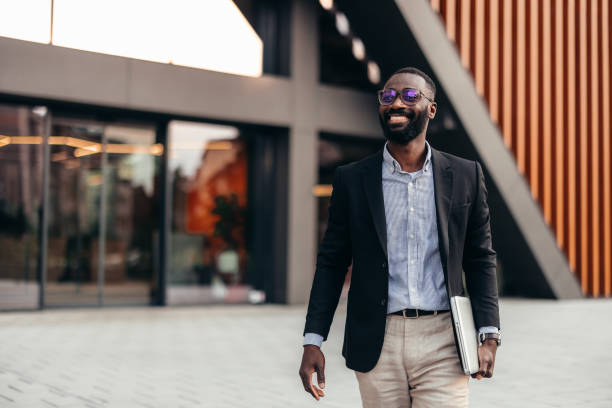istock Afro American businessman with laptop 2155149149