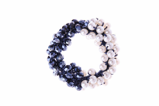 Hair elastic with blue and white beads on  isolated background.