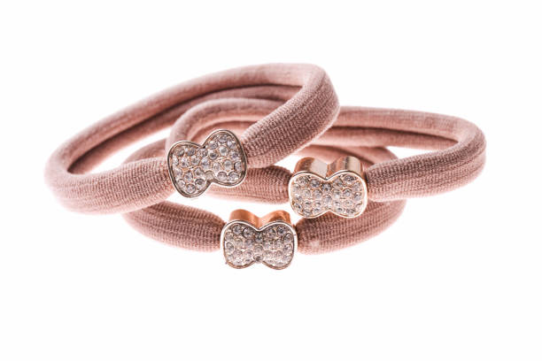 Brown hair elastic with rhinestones isolated on white background.