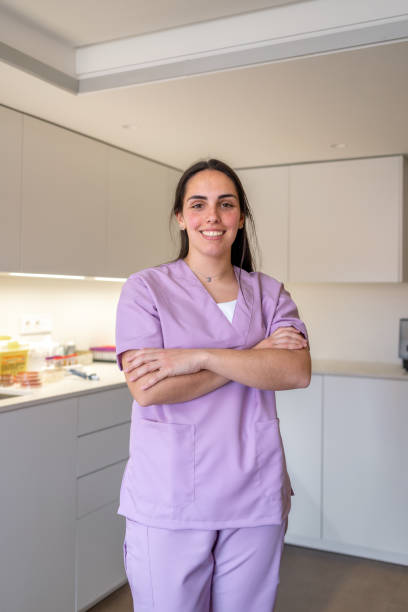 istock Proud laboratory technician smiling at camera standing with arms crossed 2155153638