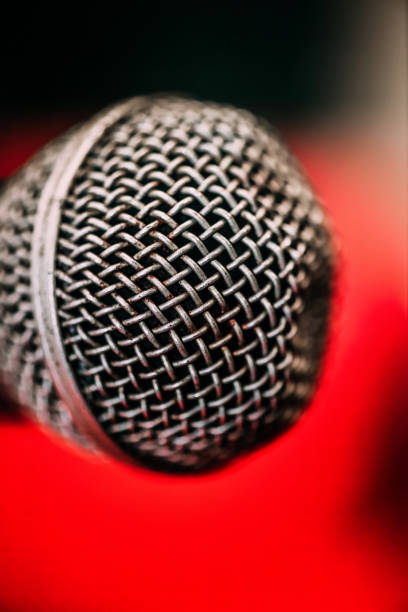 istock Close-Up of Microphone at Concert Venue During Evening Performance 2155153912