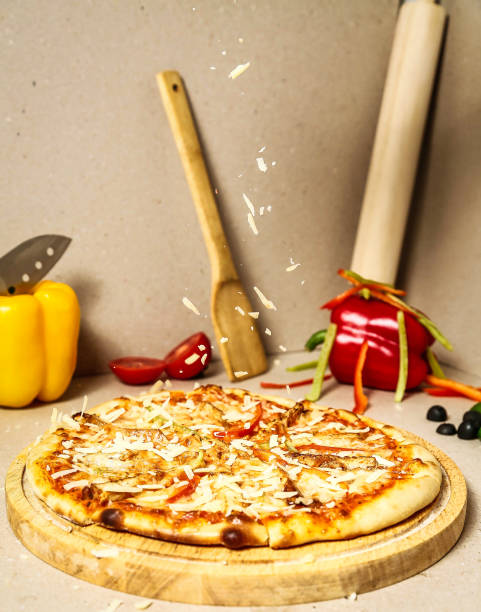 istock Pizza on Wooden Cutting Board 2155159693