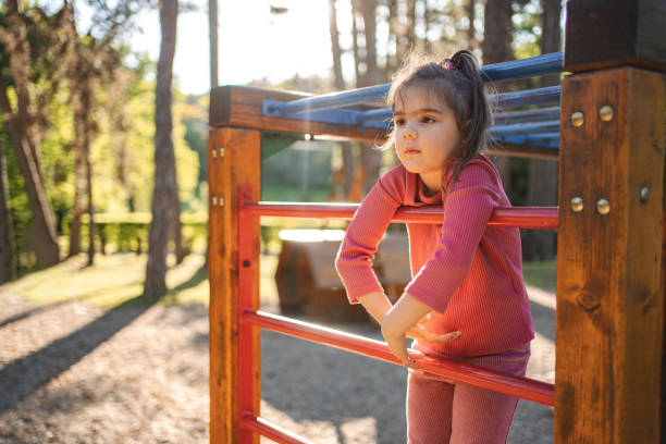 Active cute little girl on the playground.
