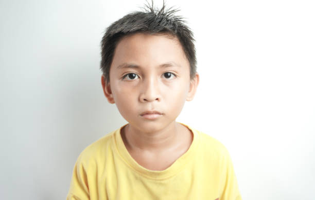 Close-up face boy is looking at the TV.