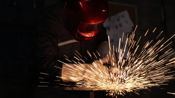 istock Engineer in Full Protective Suit Skillfully Welding Metal in Workshop with Beautiful Sparks. The engineer's skill and precision. Manufacturing, engineering, and industrial craftsmanship. 2155170040