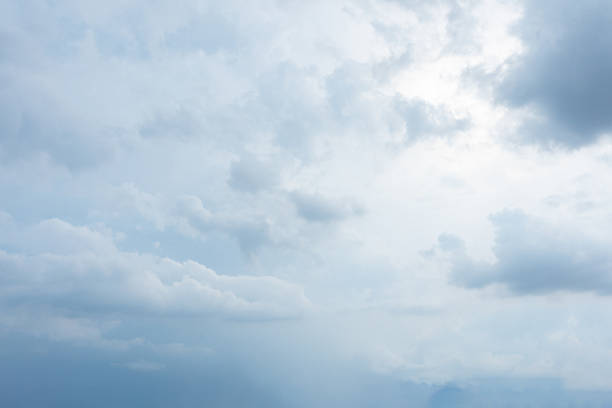 Blue Sky with Clouds: A serene view of the blue sky adorned with fluffy white clouds on a sunny summer day