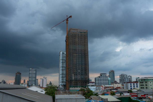 A city skyline with cranes and buildings under construction