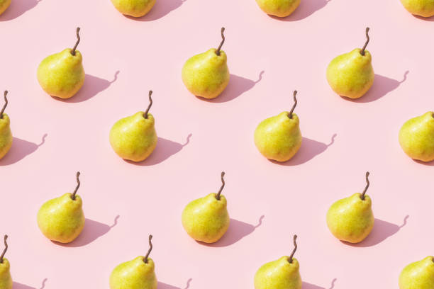istock Creative seamless pattern of yellow ripe pear on pink background 2155171097