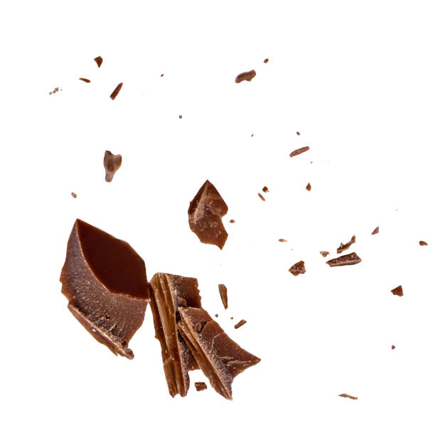 istock Chocolate explosion isolated on white.  Flying milk Chocolate pieces  Top view.  Flat lay. 2155173045