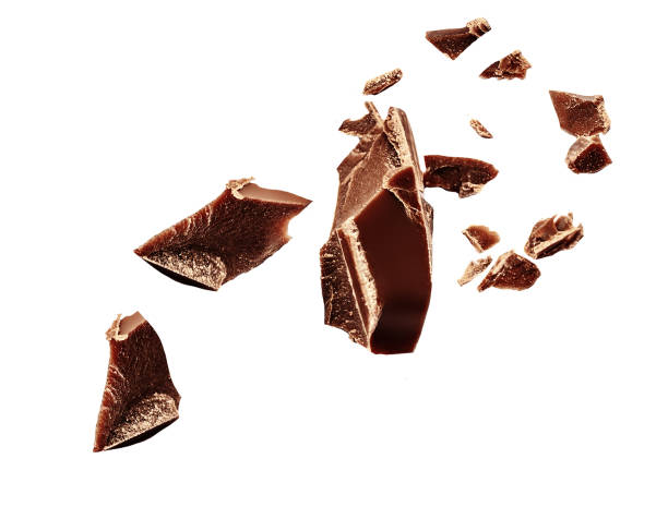 istock Chocolate explosion isolated on white.  Flying milk Chocolate pieces  Top view.  Flat lay. 2155173079
