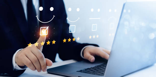 istock Satisfaction, quality and performance.Businessman gives leave feedback on the bought product with five star rating. Review customer satisfaction feedback. 2155173105