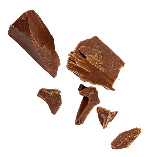 istock Chocolate explosion isolated on white.  Flying milk Chocolate pieces  Top view.  Flat lay. 2155173177