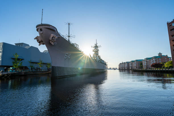 The USS Wisconsin, located in Norfolk Virginia during sunset.