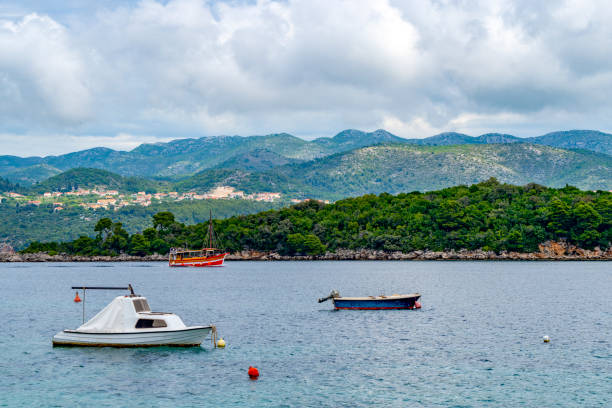 The harbour at Kolocep Island, Croatia.  In the foreground is boats moored in the harbour.