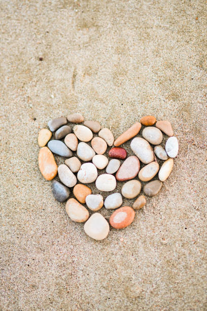 istock A heart made of rocks on a sandy beach 2155186210