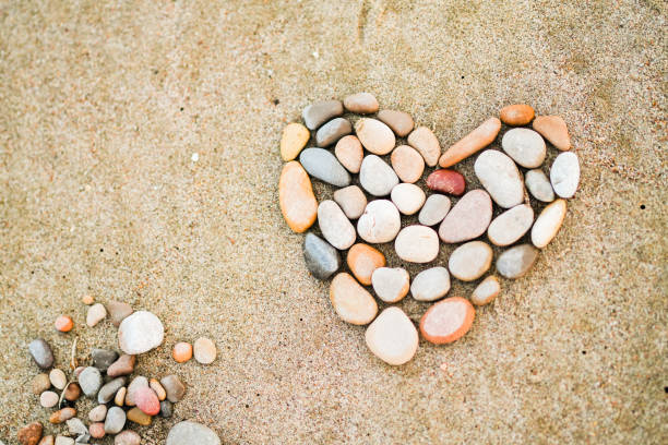 istock A heart made of rocks on a sandy beach 2155186214