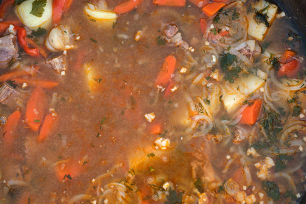 hot shurpa soup in a cauldron with a top view