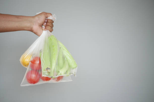 istock Hand Carrying Fresh Vegetables in Clear Plastic Bag, Healthy Eating and Zero Waste Concept 2155191359