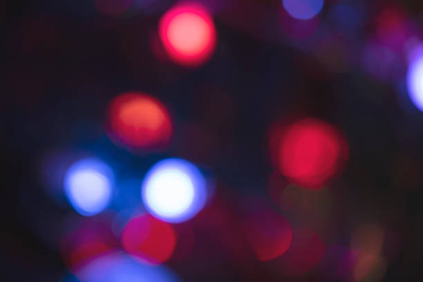 Blur of  of bulb red and blue with multi colors lighting in the dark background