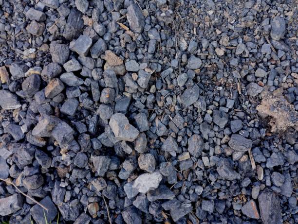 istock Texture of black stone coal poured on a pile. Industry and coal mining. Natural resources and fossil minerals. 2155193925
