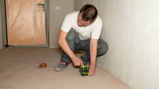 istock Builder worker makes repairs in the apartment. House renovation. Professional measuring device 2155193944