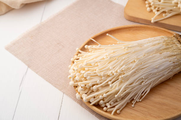 istock Fresh golden needle mushroom or enoki, enokitake (Flammulina velutipes) 2155194018