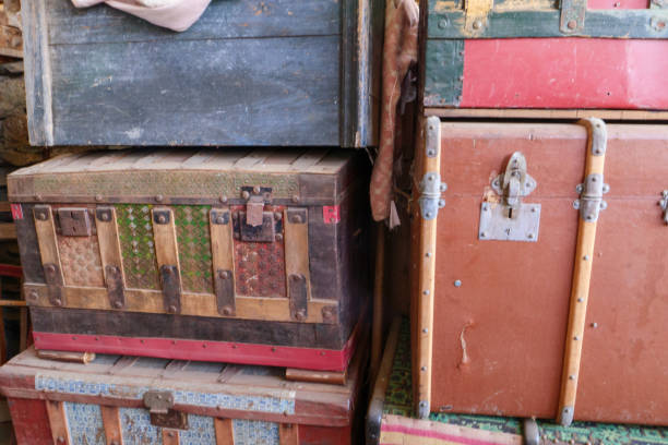istock Old suitcases sit forgotten and dusty in a storage room 2155198254