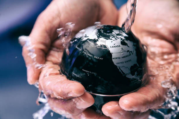 istock Water pouring on planet earth 2155198625