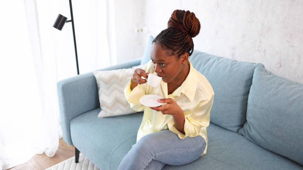 istock Happy woman enjoying her morning coffee 2155204369